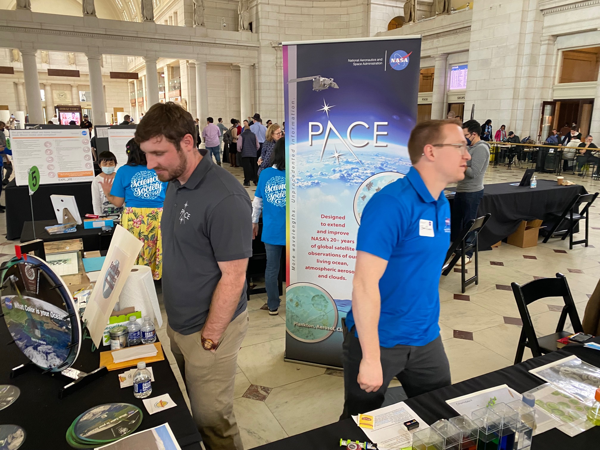 PACE members Emerson Sisk and Zakk Rhodes talk with attendees about PACE and the spacecraft build.