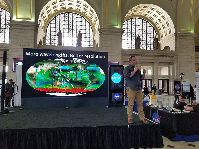 PACE Project Scientist Dr. Jeremy Werdell concludes a hyperwall talk that he presented for a public audience at the NASA Earth Day event in Washington, D.C. Credit: NASA PACE