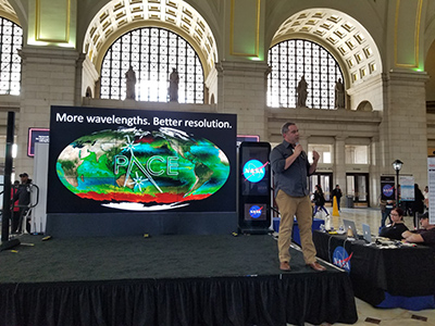 PACE Project Scientist Dr. Jeremy Werdell concludes a hyperwall talk that he presented for a public audience at the NASA Earth Day event in Washington, D.C. Credit: NASA PACE