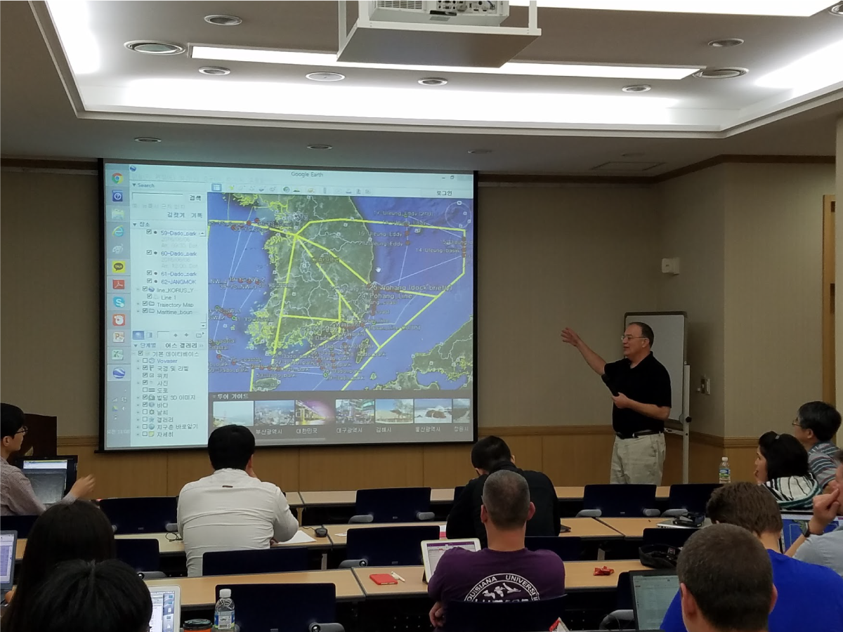 Scientists discuss the combined ship-based and airborne tracks for the field campaign