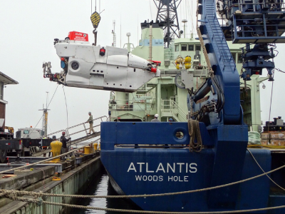 <em>Alvin</em>, a 3-person research submarine, is offloaded from the R/V <em>Atlantis</em> during preparation for NAAMES. Credit: Dick Pittenger (WHOI)