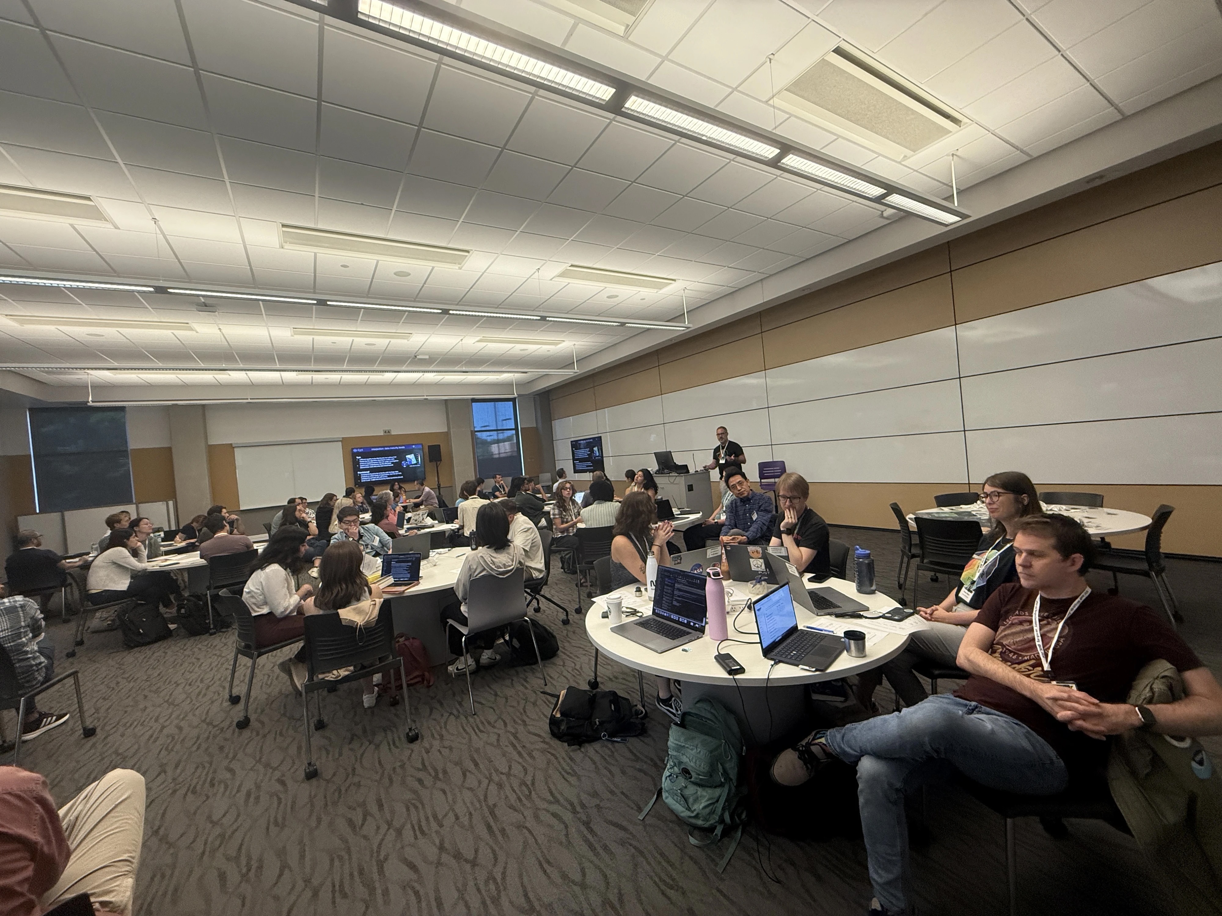 Hackweek participants in a classroom listening to a lecture by Jeremy Werdell. The CryoCloud platform by Hackweek co-lead organizer Ian Carroll provided access to cloud-hosted, scalable computing power without needing local infrastructure. Essentially, it streams PACE data like a streaming service and comes pre-configured with all the necessary Python libraries and tools. Since participants don’t need to download data to their computer, it makes the entire Hackweek easier and much more efficient. Courtesy: Anna Windle