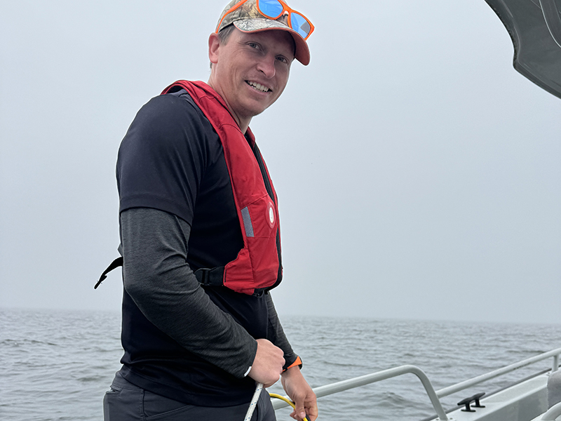 Dr. Brice Grunert on the R/V Phoenix in Green Bay, collecting a depth profile with a Sequoia hyper-bb and YSI EXO2 sonde