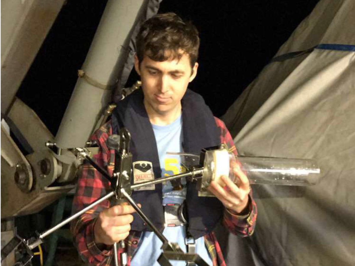 Noah Walcutt inspects mangled sediment traps