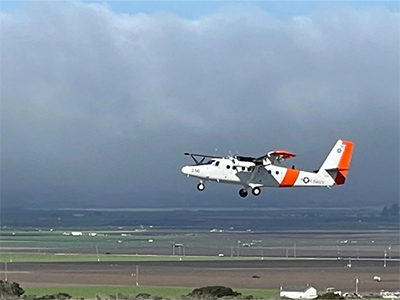 The Twin Otter aircraft operated out of the Center for Interdisciplinary Remotely Piloted Aircraft Studies (CIRPAS) during the Plankton, Aerosol, Cloud, ocean Ecosystem–Postlaunch Airborne eXperiment (PACE–PAX) campaign. The image shows the Twin Otter aircraft missing the approach at Marina Airport to check instrument performance on the aircraft against identical instrumentation on an airport control tower.